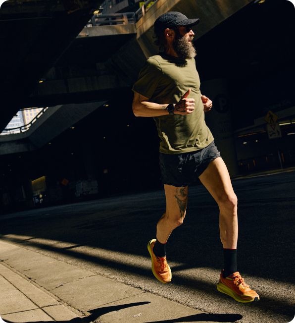 a man running on a sidewalk